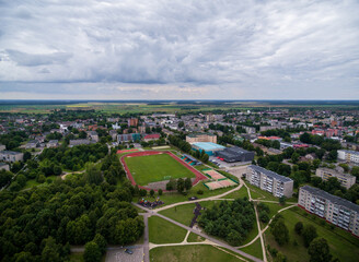Radviliskis City in Lithuania. Sport Stadium and Cityscape, Skyline in Background. Aerial, Architecture.