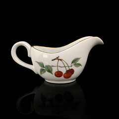 vintage milk jug with floral pattern. antique tea service.