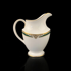 vintage milk jug with floral pattern. antique tea service.