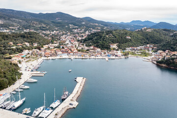 Sailboats anchored in Syvota village marina, aerial drone view.