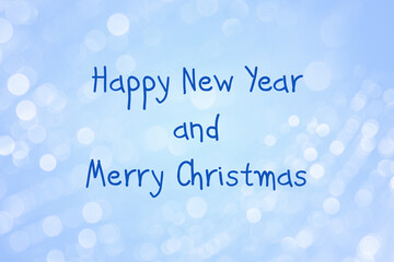 A template for a greeting card with a happy New year and Christmas. Christmas blue background with bokeh.