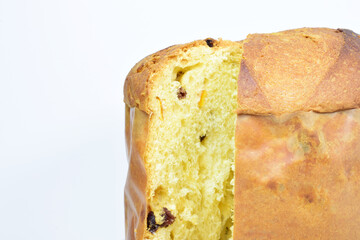Panettone, typical Italian sweet, presented on a light background. Front shot and copy space.