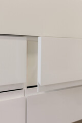 Modern MDF furniture, detail on the drawer.