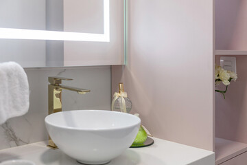 Obraz na płótnie Canvas Luxurious bathroom decorated with marble, tub and stylish faucet.