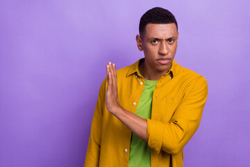 Photo portrait of handsome young man stop ban gesture serious strict face wear trendy yellow...