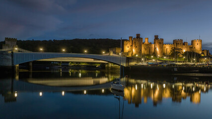 Conwy Castle and harbour at dusk, North Wales, on the edge of Snowdonia National Park and North Wales Coast