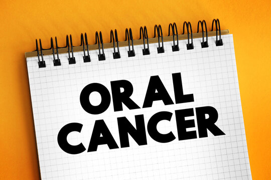 Oral Cancer - where a tumour develops in a part of the mouth, text concept on notepad