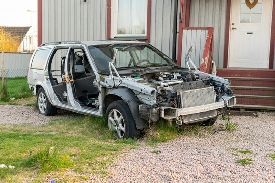 Sweden, Knislinge &ndash; May 4, 2022: A disassembled broken car in the yard of a private house. Inner parts of a car, repair. 