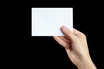 Hand holding blank card, isolated on black background