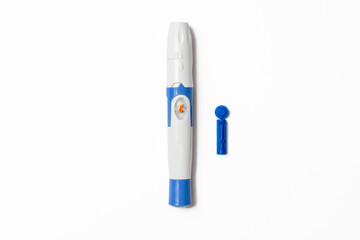 finger lancet with refill on white background and copy space for checking blood sugar level by glucose meter, glycemia concept, diabetes, Lancet white and blue color