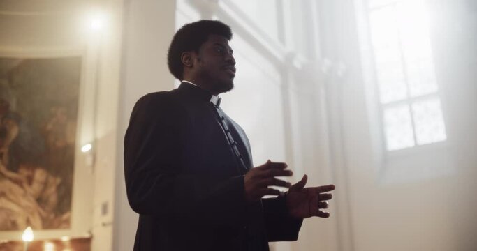 Service In Christian Church: Minister Leads Congregation In Prayer, Quotes The Bible, Gospel and Teaching of Jesus and the Prophets. Portrait of Priest Doing Sermon that Gives Hope for World Peace