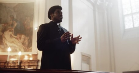 Service In Christian Church: Minister Leads Congregation In Prayer, Quotes The Bible, Gospel and Teaching of Jesus Christ. Priest Doing Sermon that Gives Hope. Beautiful Moment in Sacred Place