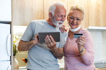 Senior couple shopping online