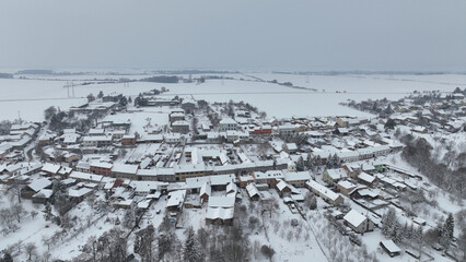 Village winter frost snow drone aerial magic snowy icing ice Bolelouc snowfall. Hana houses scenery cottage and garden magical landscape country Moravia Europe