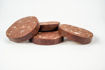 Thick slices of pork traditional butchers  black pudding isolated on a white background
