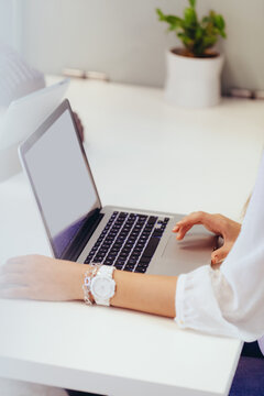 Unrecognizable woman Typing on Her Laptop