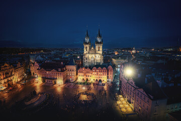 Fototapeta na wymiar Aerial view of Old Town Square with Illuminated Tyn Church at night - Prague, Czech Republic