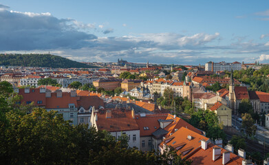 Fototapeta na wymiar Aerial view of Nove Mesto with Prague Castle and Petrin Hill on background - Prague, Czech Republic