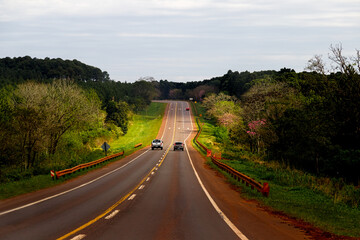 Pickup truck overtakes a car on Highway 12 in Misiones, Argentina © simonmayer