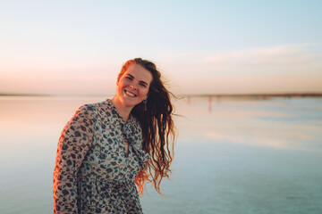 Portrait happy laughing woman in pink dress