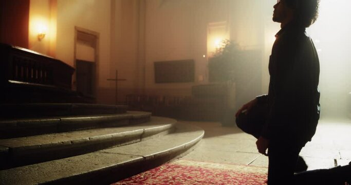 Christian Man Getting on his Knees In Front of the Altar and Starting to Pray in a Church. He Seeks Guidance From his Religious Faith and Spirituality. Image of Christianity and Belief in God
