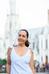 Beautiful tourist woman at the Ortiz Bridge with La Ermita church on background in the city of Cali in Colombia