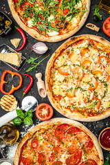 Set Pizza background. various kinds of Italian pizza on a dark background, Fast food lunch, vertical image. top view. place for text