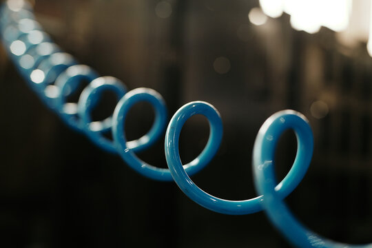 Close-up shot of blue spiral cable on dark background