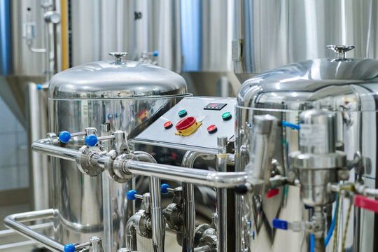 Horizontal Image Of Storage Tanks For Brewing Alcoholic Beverages With Control Panel In Factory