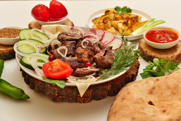 grilled meat with vegetables and salad