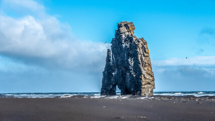 the sea and sky witih mountain monolith