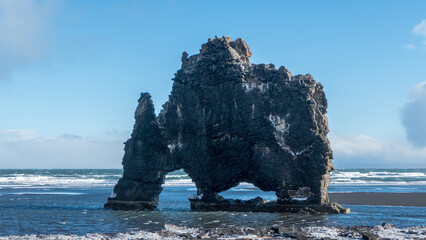 snow covered rocks on beach