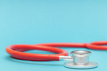 medical stethoscope on a blue background shot with blur.