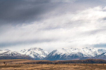 Scenic view of Lake Tekapo east bank. Beautiful view driving along the Lilybank Road from Lake Tekapo Park towards Motuariki View Point. Stunning southern alps view along the journey. 