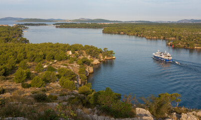  view of a boat navigating at Sveti ante canal, Šibenik, Croatia
