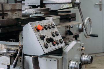 Old lathe for metal processing. Type of metal machine parts in lathe shop at factory. Industrial background. Industrial equipment..