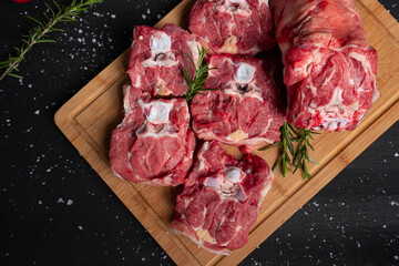Raw meat, steak on black background