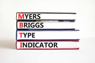 MBTI Myers Briggs type indicator symbol. Concept words MBTI Myers Briggs type indicator on books on...