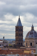 Fototapeta na wymiar Old Historic Catholic Church in City of Rome, Italy. Aerial View. Cloudy Sky