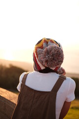 girl taking a walk watching the sunset on vacation evening 15-12-2022