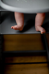 Vertical photo of small baby feet