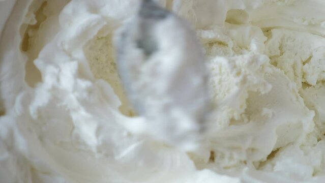 spoon with cottage cheese. the process of cooking tiramisu. the spoon is gaining cottage cheese