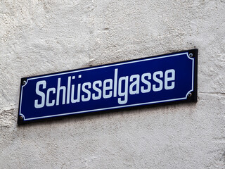 Signboard with the street name Schlusselgasse - Key Alley in Zurich, Switzerland