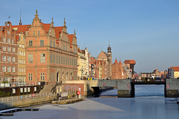 Gdansk embankment with historical buildings in winter with frozen river Motlawa. Poland, Europe.