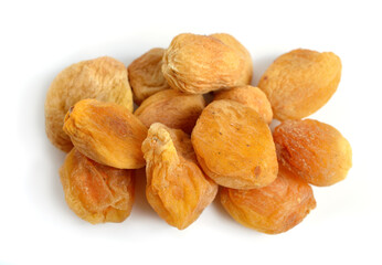 Whole Sun-dried apricots with stones. Isolated on white background