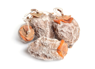 Whole dried oriental persimmons isolated on white background
