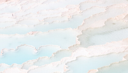 Emerald water in white limestone rock.