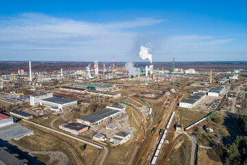 Chemistry Factory in Lithuania, Achema in Jonava City. Clear Blue Sky and Smoke in background. Drone