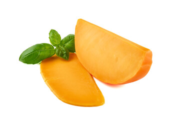 Wedge of orange French Mimolette cheese isolated on white background.