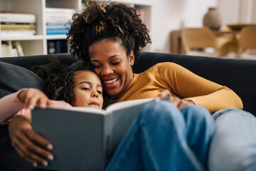 Mother and daughter spend time together while reading the book